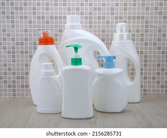 Cleaning Agent, Detergent And Liquid Soap Dispenser Bottle On The Bathroom Background. Product Presentation Of Cleaning Products Mockup. Home Cleaning Supplies In Plastic Bottles Mock Up