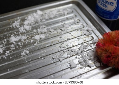 Cleaning Baking Tray With Baking Soda And Vinegar Close Up. Soft Focus Image.                    