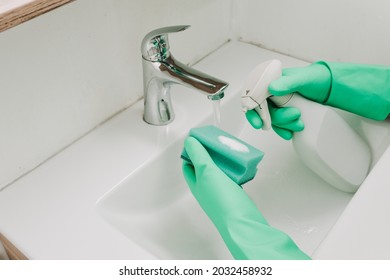 cleaning bath at home. washing bathtub and faucet - Shutterstock ID 2032458932