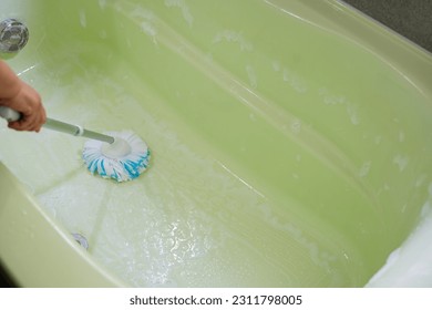 Cleaning the bath room at home - Shutterstock ID 2311798005