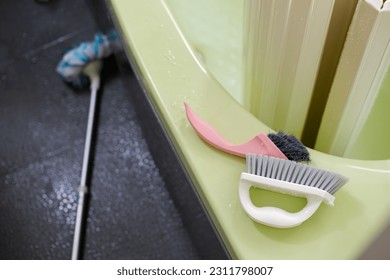 Cleaning the bath room at home - Shutterstock ID 2311798007
