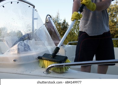 Cleaning Boat With Brush