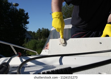 Cleaning Boat With Small Brush