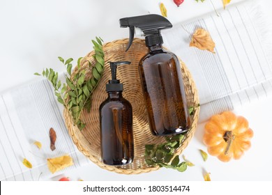 Cleaning bottles on fall backdrop