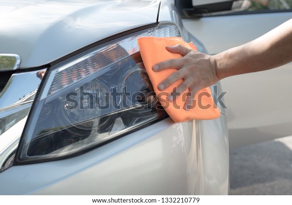 Cleaning by\
hand in the front with a Microfiber\
cloth