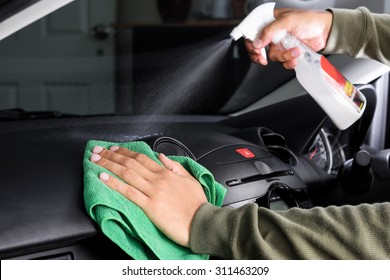 Cleaning The Car Console With Microfiber Cloth