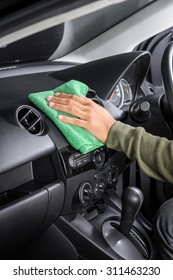 Cleaning The Car Console With Microfiber Cloth