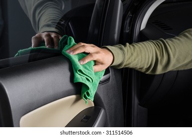 Cleaning The Car Console With Microfiber Cloth