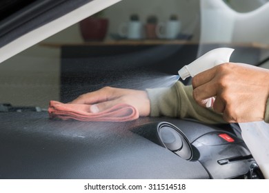 Cleaning The Car Console With Microfiber Cloth