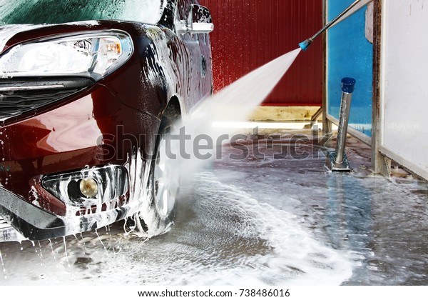 Cleaning car with high
pressure water