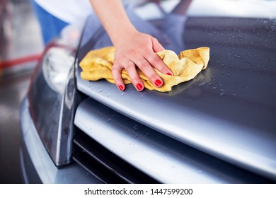 Cleaning car with microfiber cloth