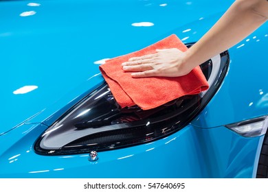 cleaning the car with microfiber cloth - Shutterstock ID 547640695
