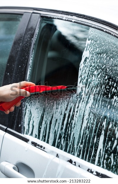 Cleaning car on a car wash,\
vertical