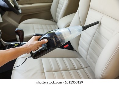 Cleaning A Car Using A Vacuum Cleaner