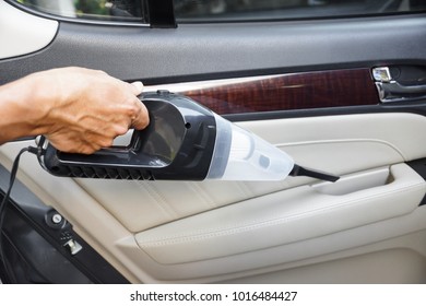 Cleaning A Car Using A Vacuum Cleaner