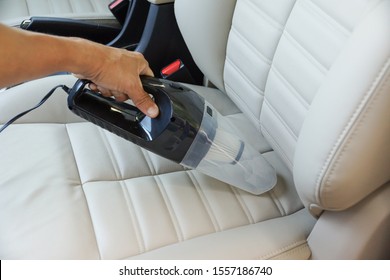 Cleaning A Car Using A Vacuum Cleaner