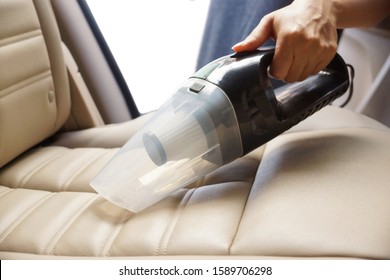 Cleaning a car using a vacuum cleaner