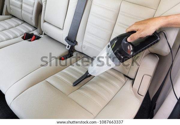 Cleaning a car using a
vacuum cleaner