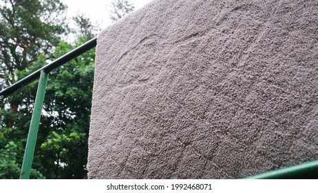 Cleaning Carpet With Cheap Carpetbeater On Outdoor Public Carpet Hanger Creating Clouds Of Dust And Dirt Slow Motion