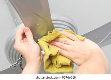 Cleaning The Ceiling Fan With A Cloth