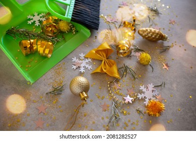 Cleaning Christmas After The Holiday. Cleaning Brush And Scoop And Christmas Decorations After Party On Gray Background. Concept Of Cleaning After Holiday, Clean Up The Mess