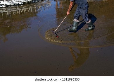 Cleaning Of City Fountains Before Winter. Workers Clean The Mud That Has Settled Over The Season.