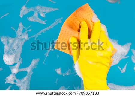 Cleaning concept, hand with a rag cleans the surface