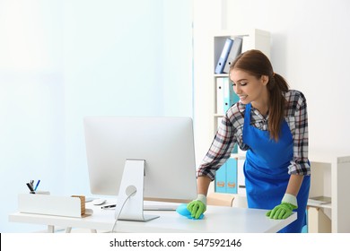 Cleaning Concept. Young Woman Cleaning Office