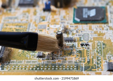 Cleaning Dirty Desktop Computer Processor Fan From Dust By Special Brush Close Up.