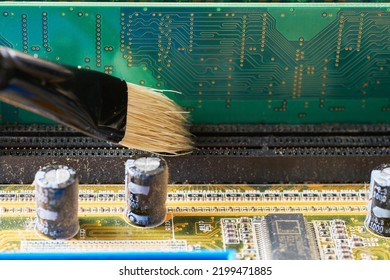 Cleaning Dirty Desktop Computer Processor Fan From Dust By Special Brush Close Up.