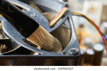 Cleaning Dirty Desktop Computer Processor Fan From Dust By Special Brush Close Up.