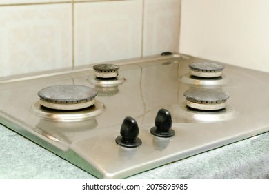 Cleaning Dirty Gas Stove From Grease, Food Leftovers. Washing Kitchen Stove. Home Cleaning Service Concept.