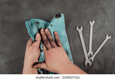 Cleaning Dirty Hands With A Piece Of Clothes, Fuel Oil, Mechanic Worker, Repair Service, Dark Background