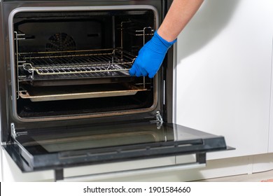 Cleaning A Dirty Oven In The Kitchen