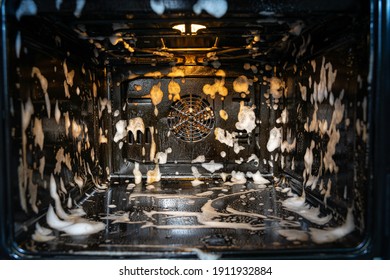 Cleaning A Dirty Oven In The Kitchen