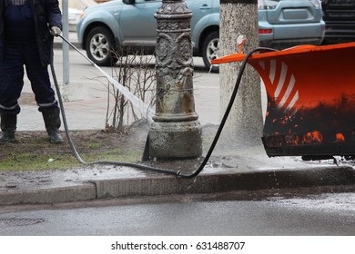 Cleaning The Dirty Post In The City Post With High Pressure Washer In The Spring