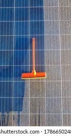 Cleaning Dirty Solar Panel At Sunset