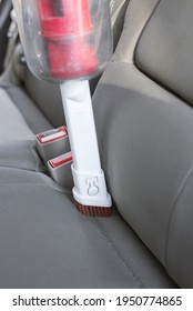 Cleaning Dirty Vehicles Interior Uses Wireless Vacuum Cleaner. Cleans The Light Cloth Interior Of The Car. Spring Dry Automobile. Car Care Work. Helpful Device For Cleaning Car Seat.