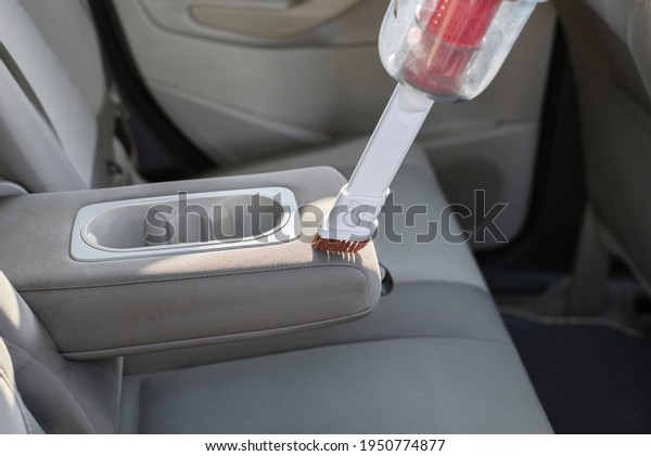 Cleaning dirty\
vehicles interior uses wireless vacuum cleaner. Cleans the light\
cloth interior of the car. Spring dry automobile. Car care work.\
Helpful device for cleaning\
dust.