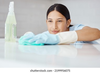 Cleaning, Disinfect And Housework With Woman Washing Kitchen Table With Spray Product To Sanitize, Clean And For Hygiene. Housewife, Cleaner Or Housekeeper With Sanitary Detergent And Tidy Apartment