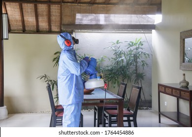 Cleaning And Disinfecting: Key Weapons In The Fight Against Contagious Diseases. Spray Disinfection Of Surfaces In The House.
Fogging With Disinfectant Due To Coronavirus.

