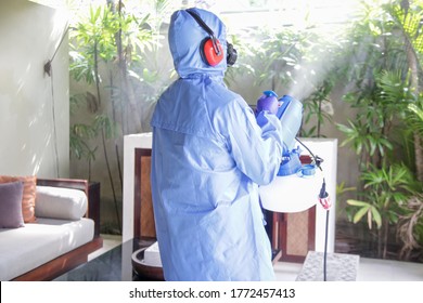 Cleaning And Disinfecting: Key Weapons In The Fight Against Contagious Diseases. Spray Disinfection Of Surfaces In The House. Fogging With Disinfectant Due To Coronavirus.