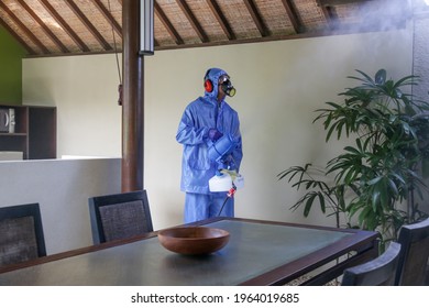 Cleaning And Disinfecting: Key Weapons In The Fight Against Contagious Diseases. Spray Disinfection Of Surfaces In The House. Fogging With Disinfectant Due To Coronavirus.