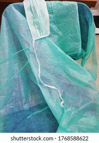 Cleaning And Disinfection Of Coronavirus COVID19 Protection Gowns With Water And Bleach Solution