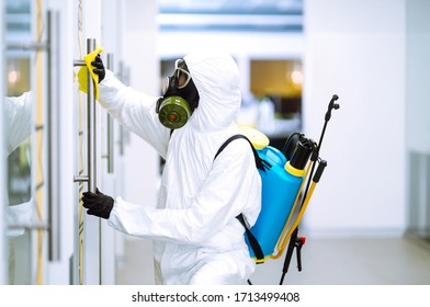 Cleaning and disinfection of office to prevent COVID-19, Man in protective hazmat suit washes office furniture to preventing the spread of coronavirus, pandemic in quarantine city. - Powered by Shutterstock