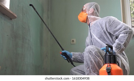 Cleaning and Disinfection at town complex amid the coronavirus epidemic. Professional teams for disinfection efforts. Infection prevention and control of epidemic. Protective suit and mask - Shutterstock ID 1618304938