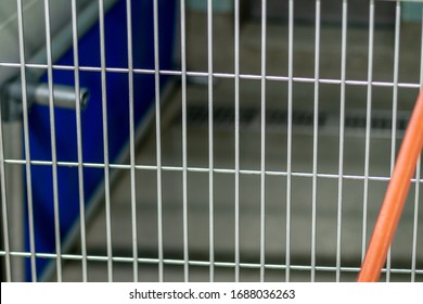 Cleaning The Dog Crates, Cat Beds And Concrete Floors With An Orange Pressure Hose By A Lady Worker Wearing A Blue Uniform Inside An Animal Pet Shelter For No Kill Adoptable And Foster Fur Babies.