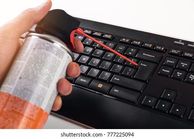 Cleaning Dust From Computer Keyboard With Air Pressure Cleaner