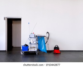 Cleaning Equipment Near A Restroom In A Clean Office Environment