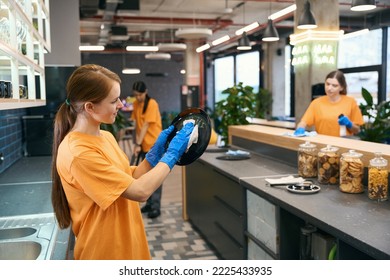 Cleaning Female Team Cleaning In Kitchen Area , Women In Work Clothes